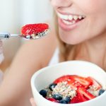 1446497187_bigstock-close-up-of-a-woman-eating-mue-7624576