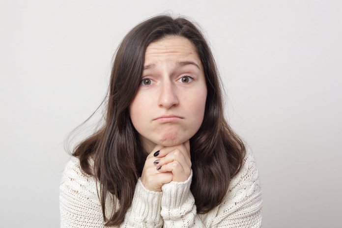 Girl with long hair asking for forgiveness and begging